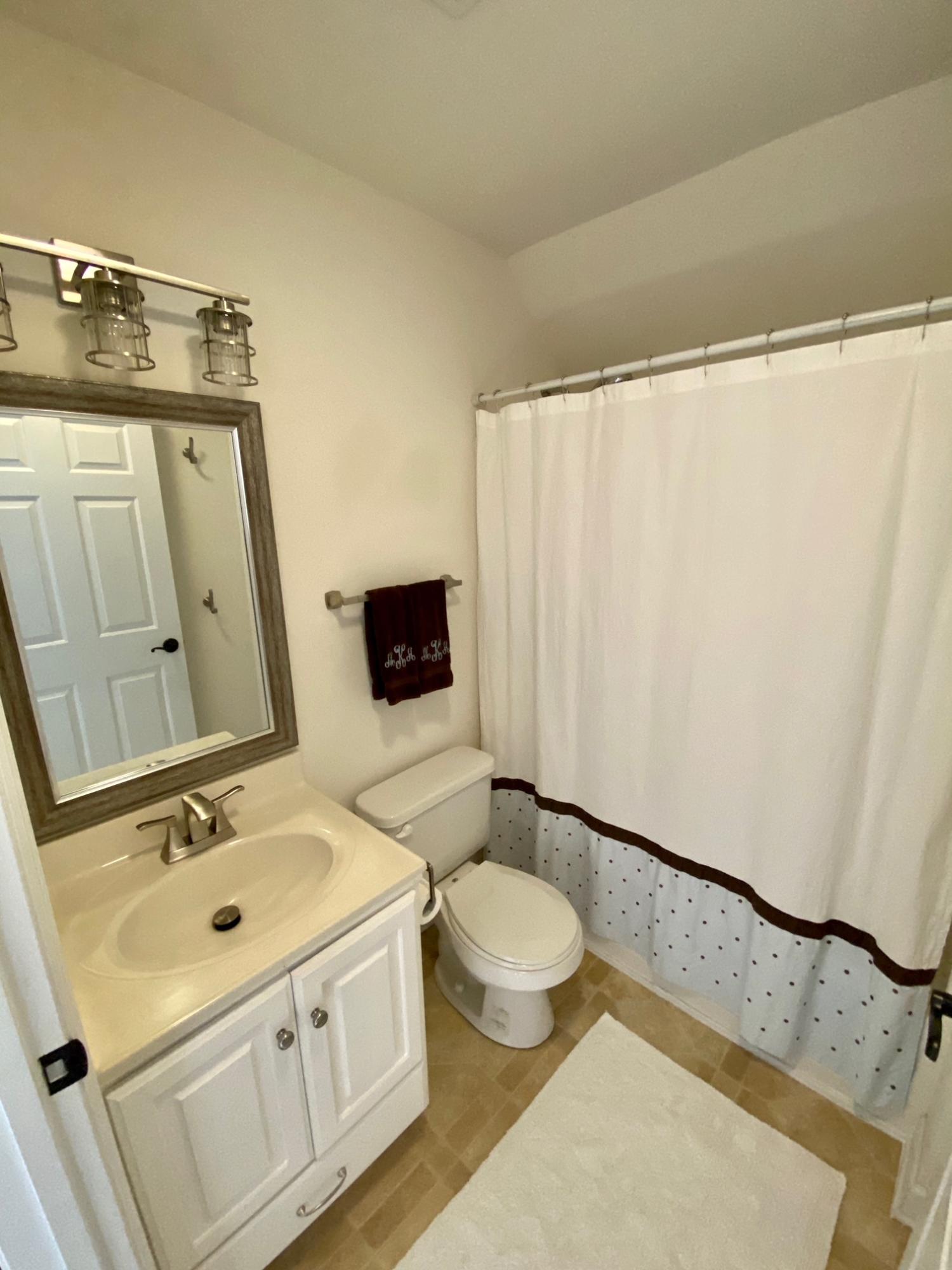 4051 Rockingham Boulevard Roanoke, VA 24014 - Photo 22 of 26 a bathroom with a sink a toilet and mirror