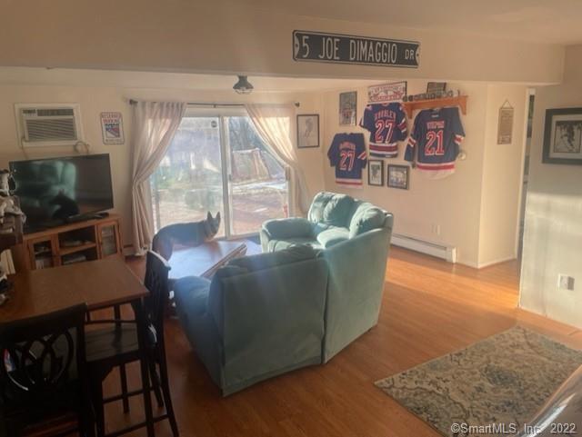 11 Shawnee Road Trumbull, CT 06611 - Photo 2 of 14 a living room with furniture and a flat screen tv