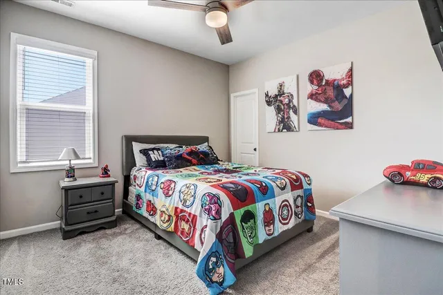 a bedroom with furniture and a window