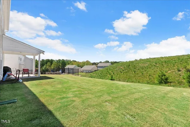 a bathroom with a sink a toilet a mirror and shower
