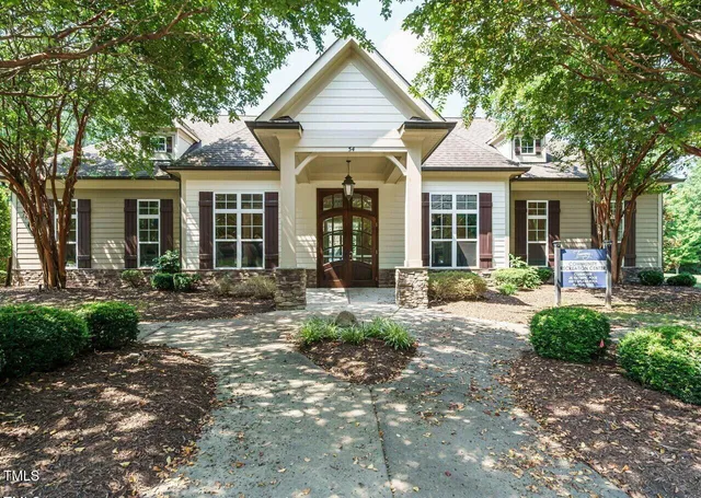 a roof deck with table and chairs