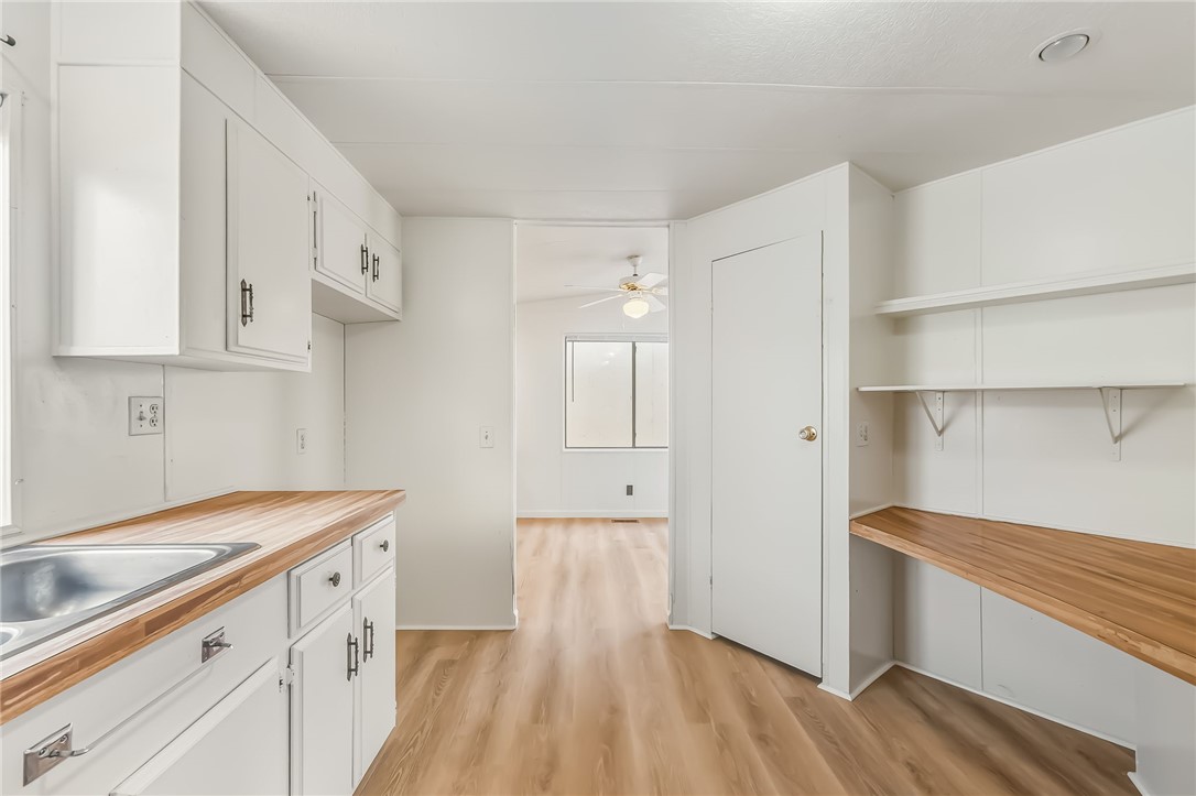 1267 Wilson Road Bullhead City, AZ 86442 - Photo 13 of 37 a view of a kitchen with wooden floor