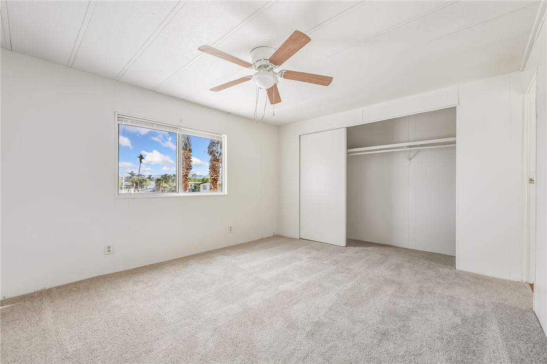 1267 Wilson Road Bullhead City, AZ 86442 - Photo 26 of 37 an empty room with closet and ceiling fan