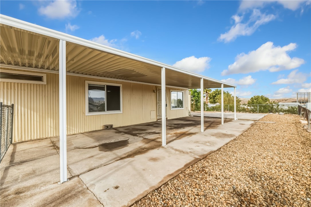 1267 Wilson Road Bullhead City, AZ 86442 - Photo 32 of 37 a view of a house with a backyard