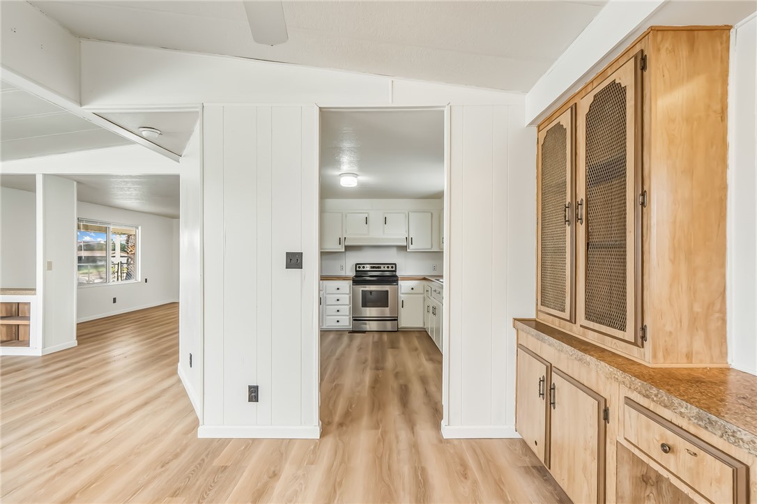 1267 Wilson Road Bullhead City, AZ 86442 - Photo 8 of 37 a view of a kitchen cabinets and wooden floor