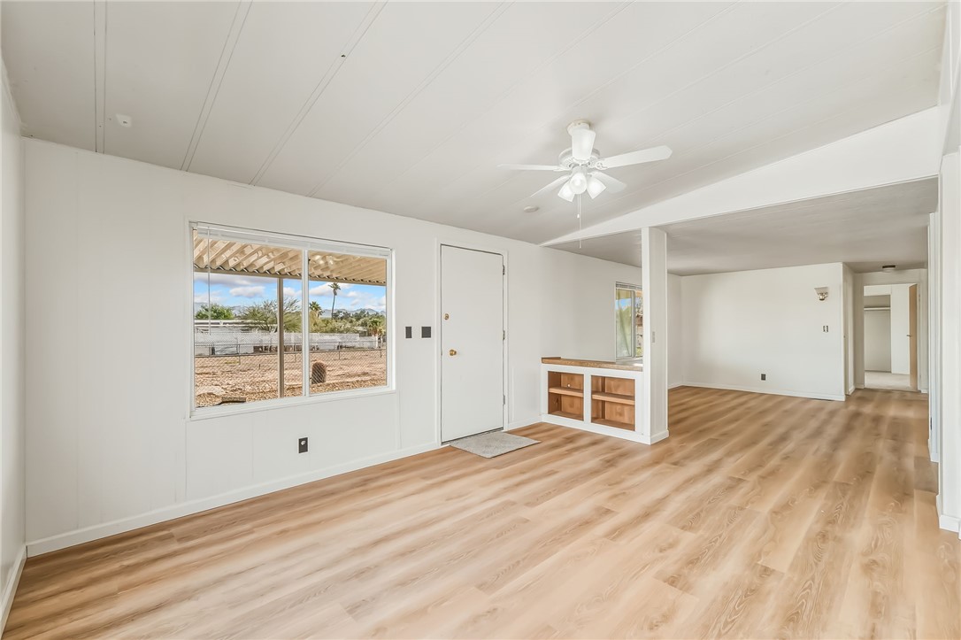 1267 Wilson Road Bullhead City, AZ 86442 - Photo 9 of 37 a view of empty room with a ceiling fan and window