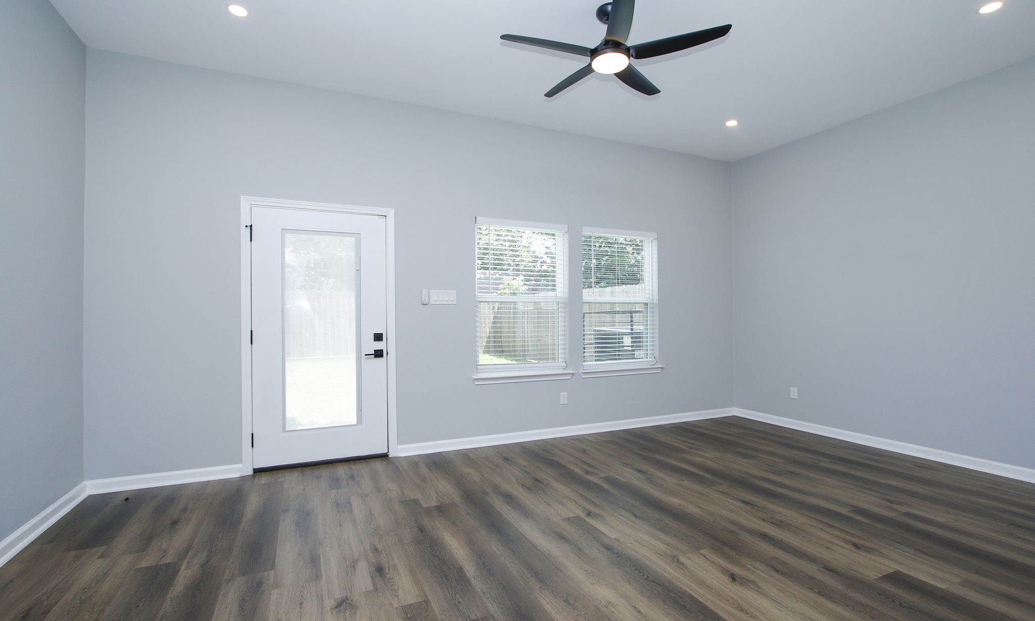 4337 Faulkner Street Houston, TX 77021 - Photo 14 of 39 wooden floor in an empty room with a window