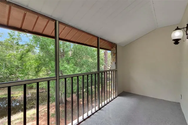 a view of a room with a large window
