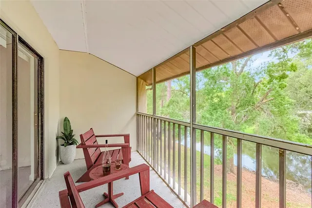 a view of a porch with furniture and outside view