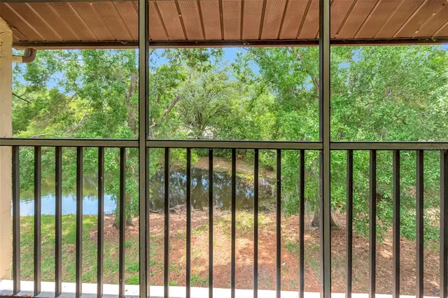 a view of a back yard from a balcony