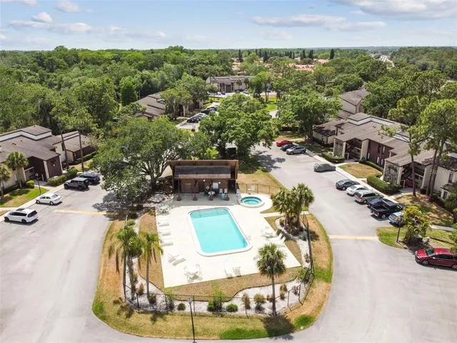 an aerial view of residential houses with outdoor space