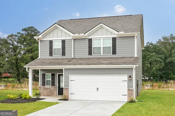 front view of a house with a yard