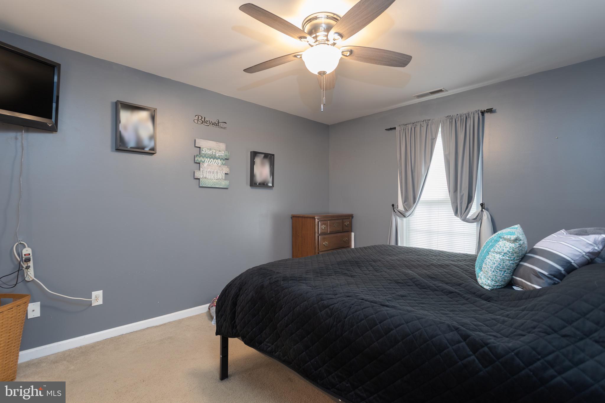1303 Colonial Avenue Cambridge, MD 21613 - Photo 10 of 12 a bedroom with a bed and a window