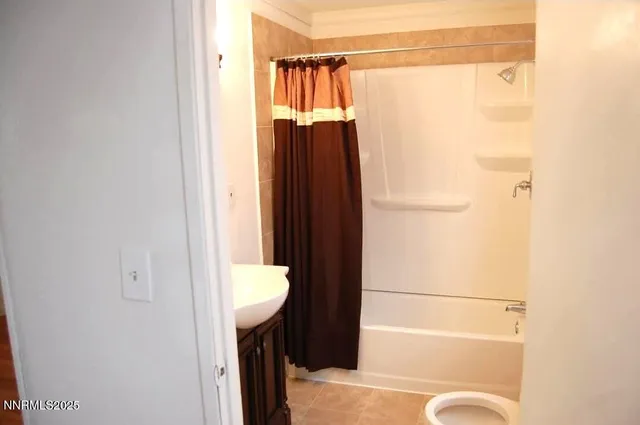 a bathroom with a shower and a toilet