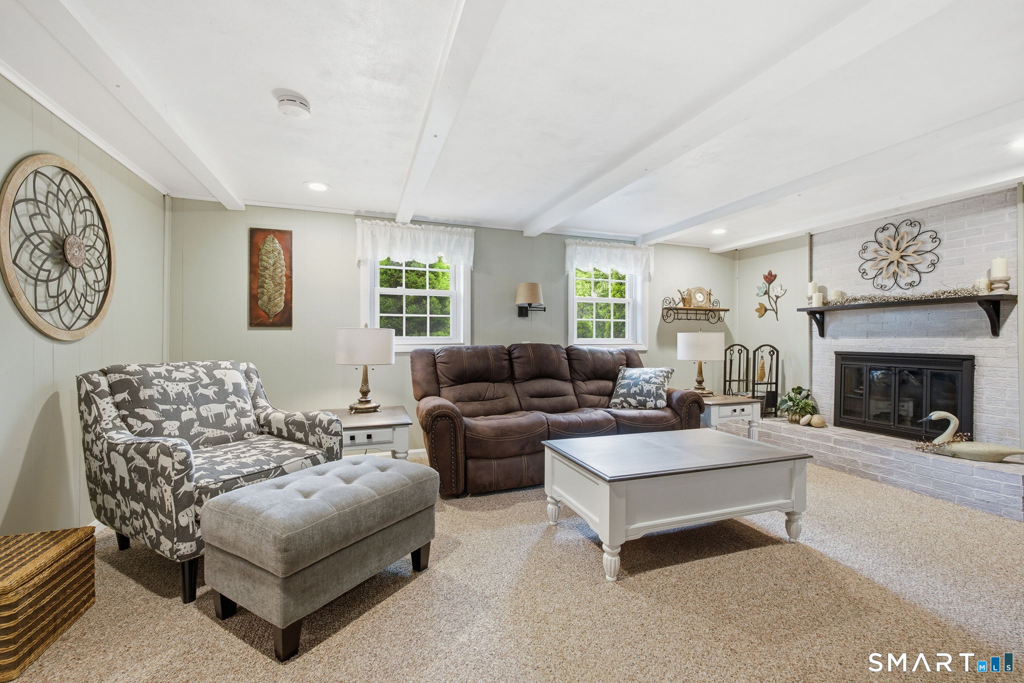 7 Stardust Drive Enfield, CT 06082 - Photo 20 of 38 a living room with furniture and a fireplace