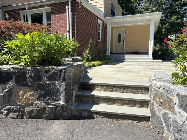 a front view of a house with a garage