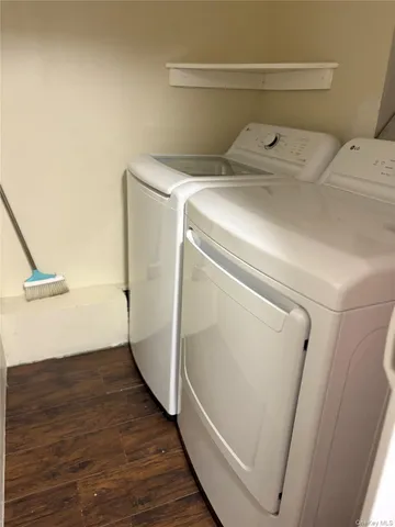 a view of a closet with wooden floor