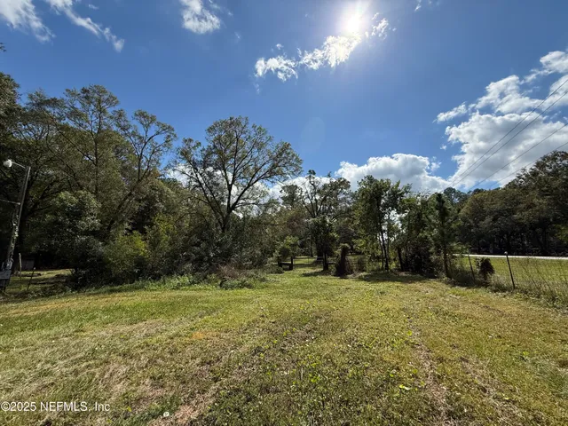 a backyard of a house with lots of green space