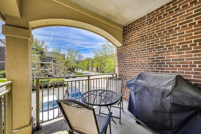 a view of a balcony with furniture