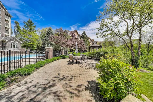 a view of a backyard with sitting area