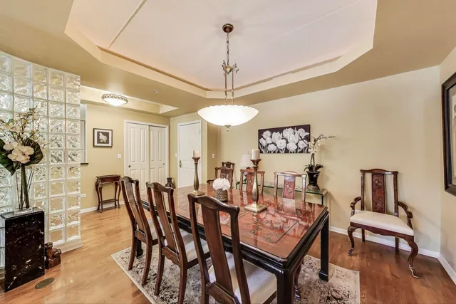 a view of a dining room with furniture and wooden floor