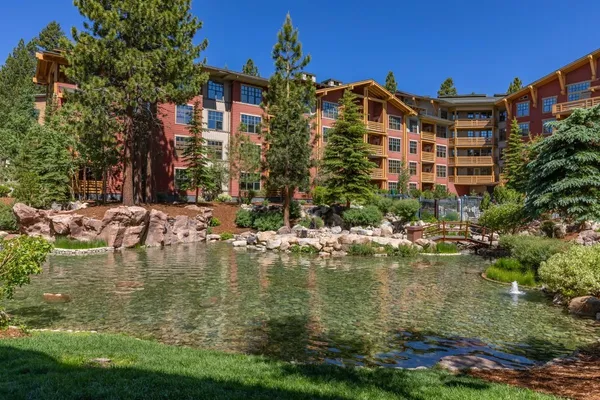 a view of a lake with a building in the background