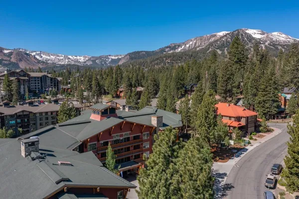 a view of multiple houses with a street