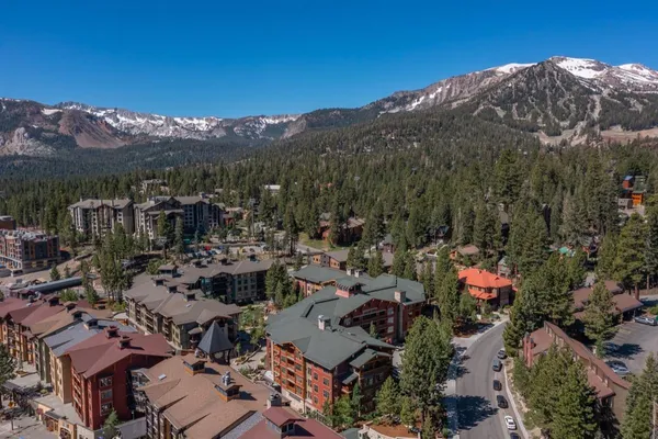a view of a town with mountains in the background