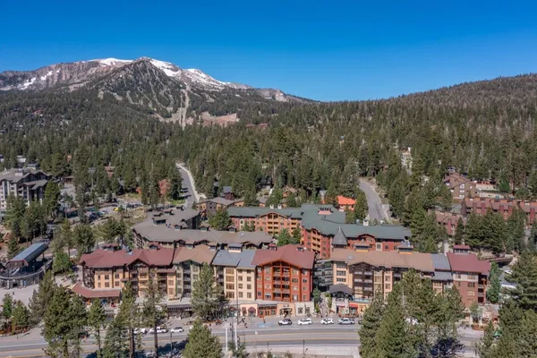 a view of a city with mountains in the background
