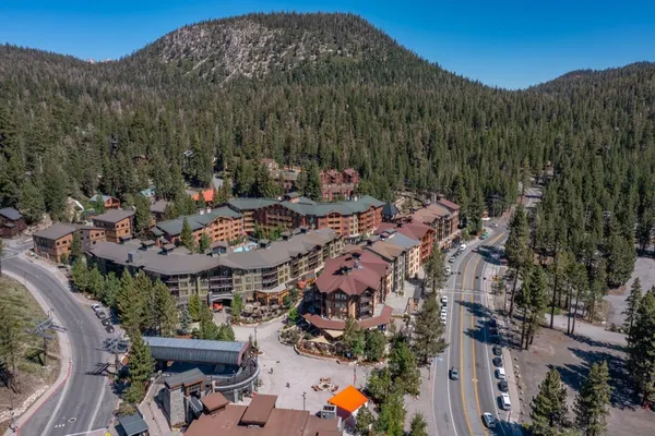 a view of a patio with table and chairs and potted plants