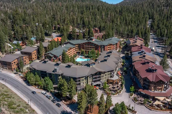 a front view of a building with glass windows and door