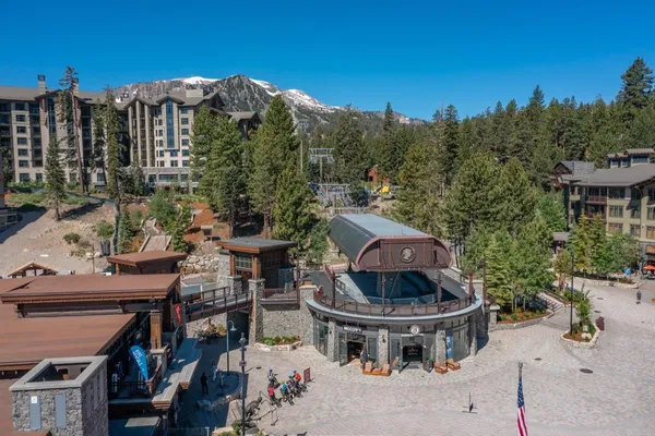 a front view of a residential apartment building with a yard
