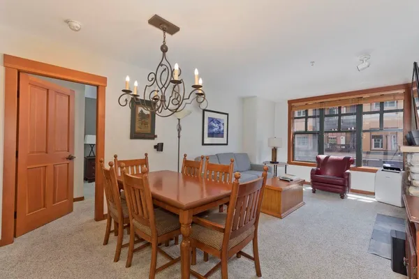 a view of a dining room with furniture window and outside view