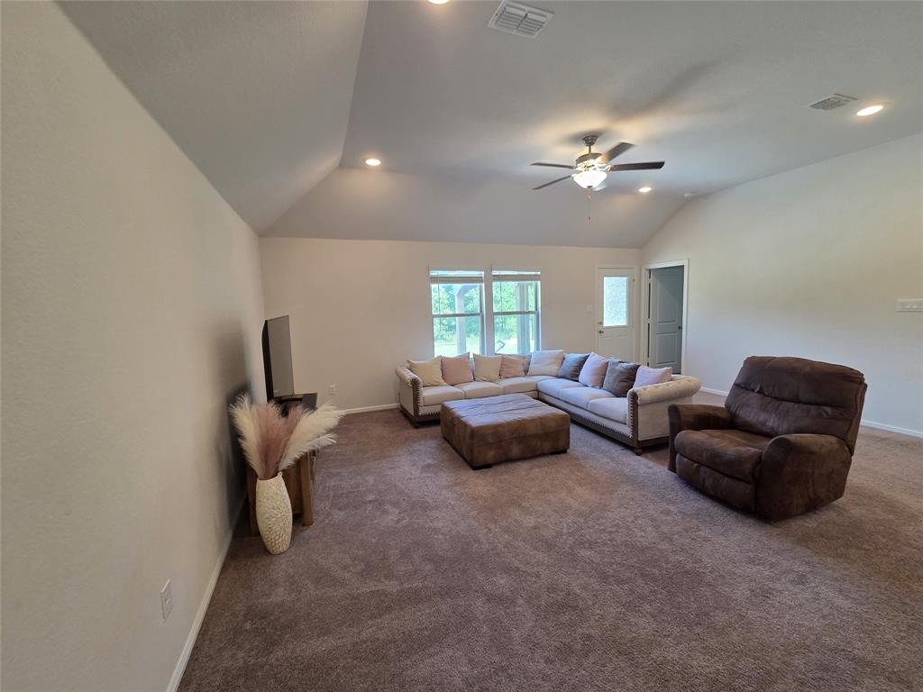 1512 Springtree Drive McKinney, TX 75071 - Photo 7 of 23 a living room with furniture and a window