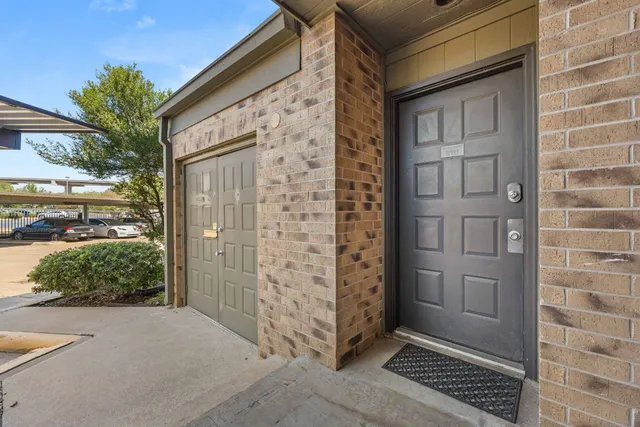 a view of a door and wooden floor