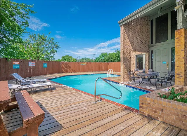 a view of a backyard with a patio and plants