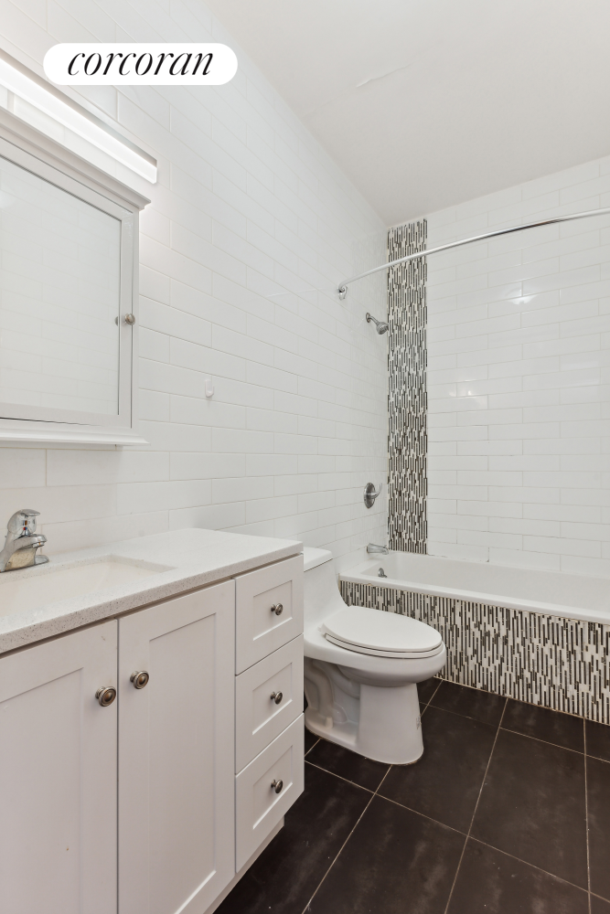 84 MacDougal Street, Unit 2 Brooklyn, NY 11233 - Photo 7 of 10 a bathroom with a sink toilet and shower