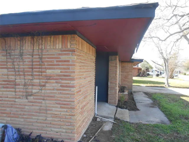 a view of a backyard of the house