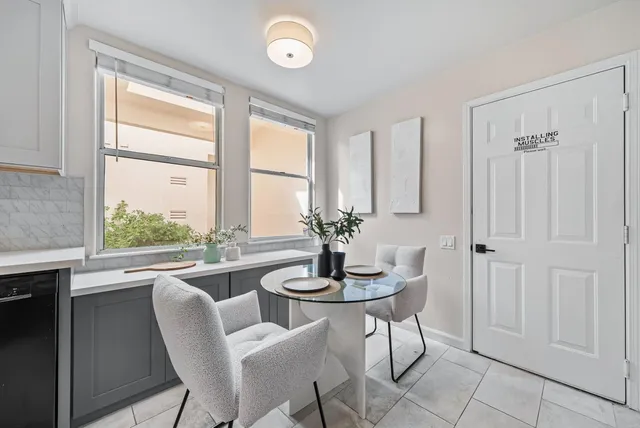 a view of a dining room with furniture window and outside view