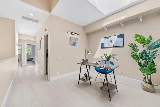 a view of a workspace with furniture