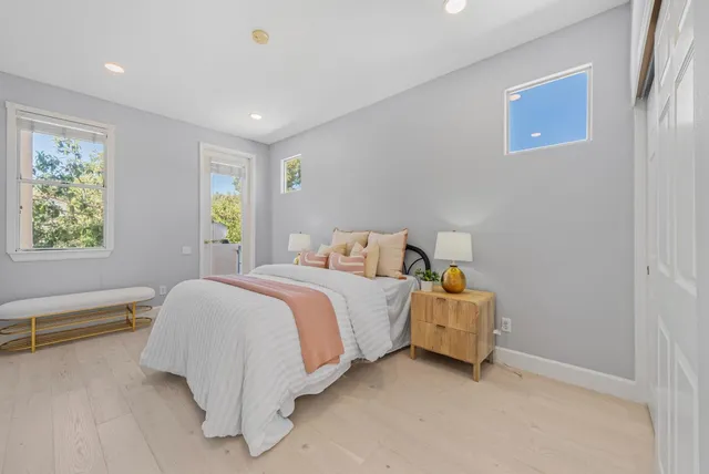 a bedroom with a bed and a view of bedroom