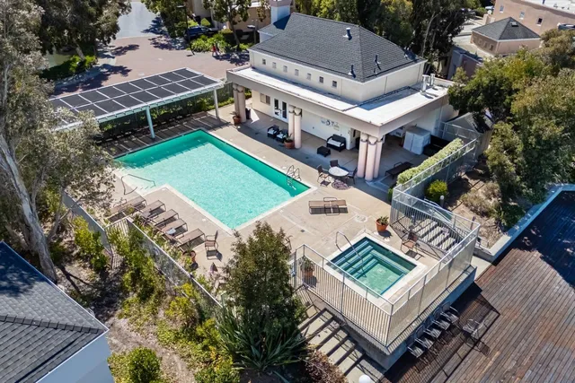 a view of a chair and tables in the patio