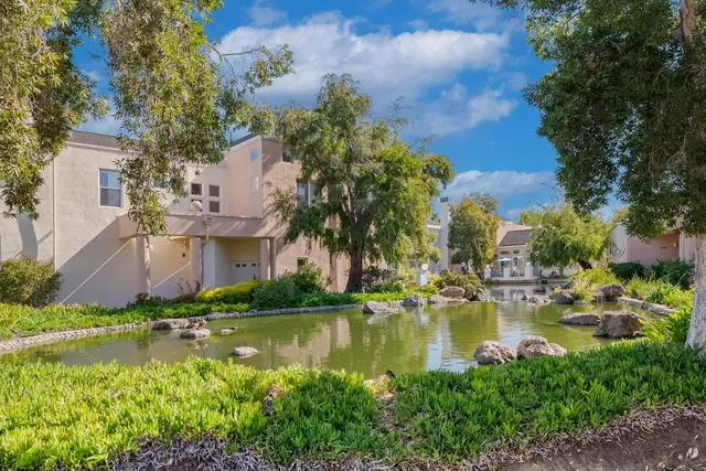 an aerial view of house with yard swimming pool and outdoor seating