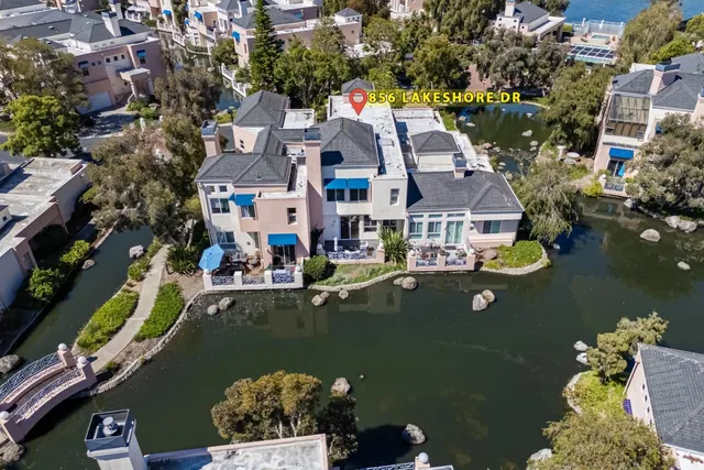 an aerial view of residential house with outdoor space and swimming pool