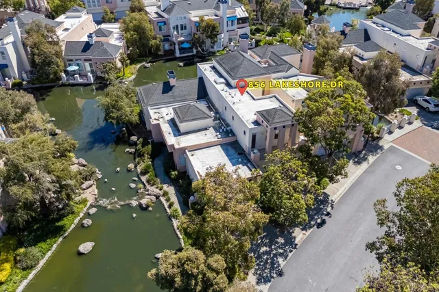 an aerial view of a houses with yard