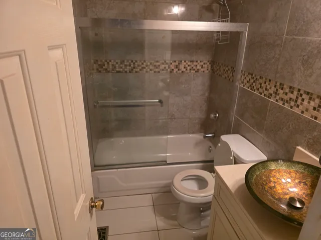 a bathroom with a toilet and shower