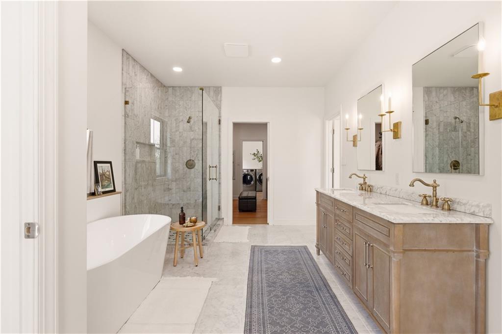 315 Stewarton Road Mill Run, PA 15464 - Photo 27 of 47 a spacious bathroom with a bathtub shower sink double and mirror