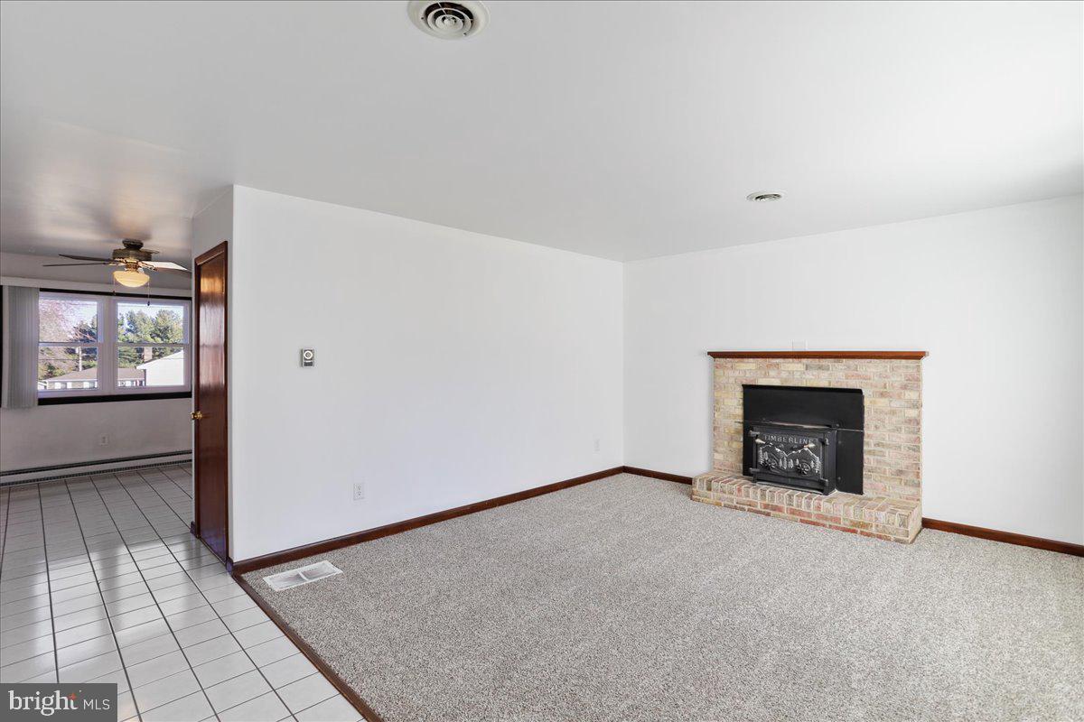 11910 Beavervale Road Smithsburg, MD 21783 - Photo 4 of 27 Living Room w/ wood burning stove