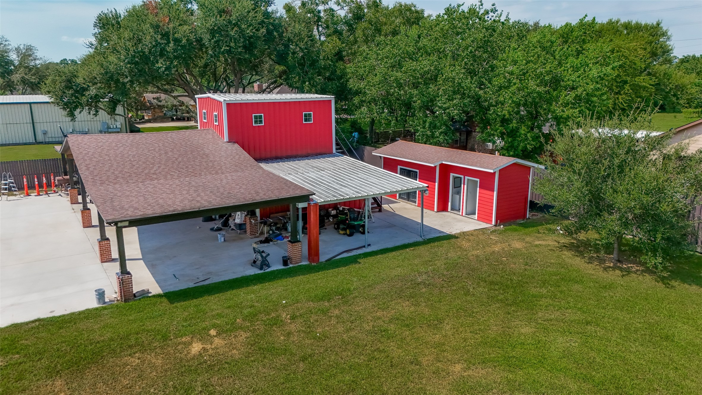 aerial view of a house with backyard porch and furniture