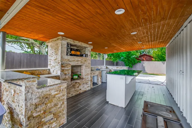 a view of a patio with table and chairs